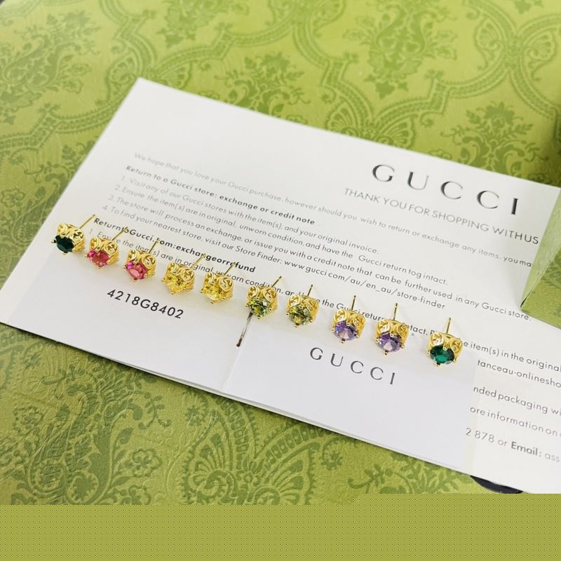 G*u*i earrings